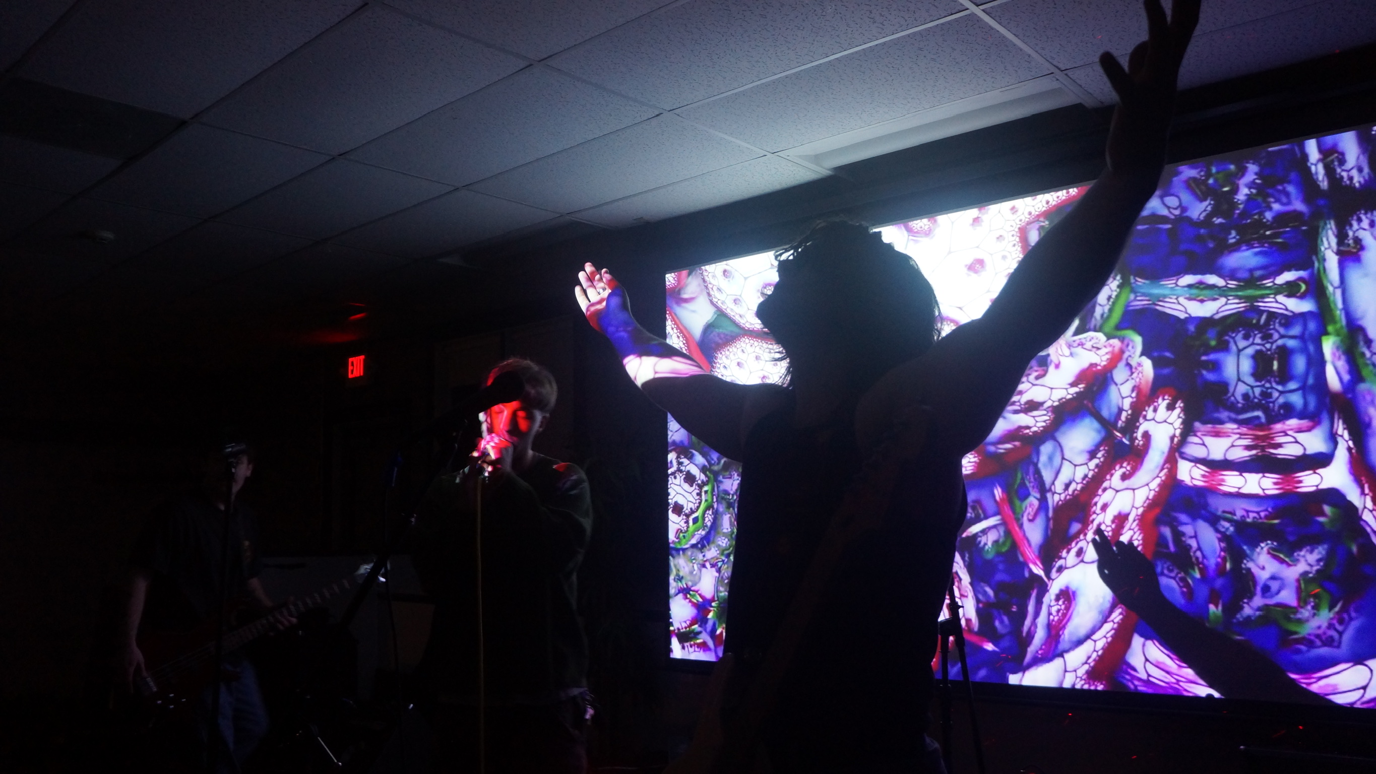 Cristiano performing with arms spread on stage