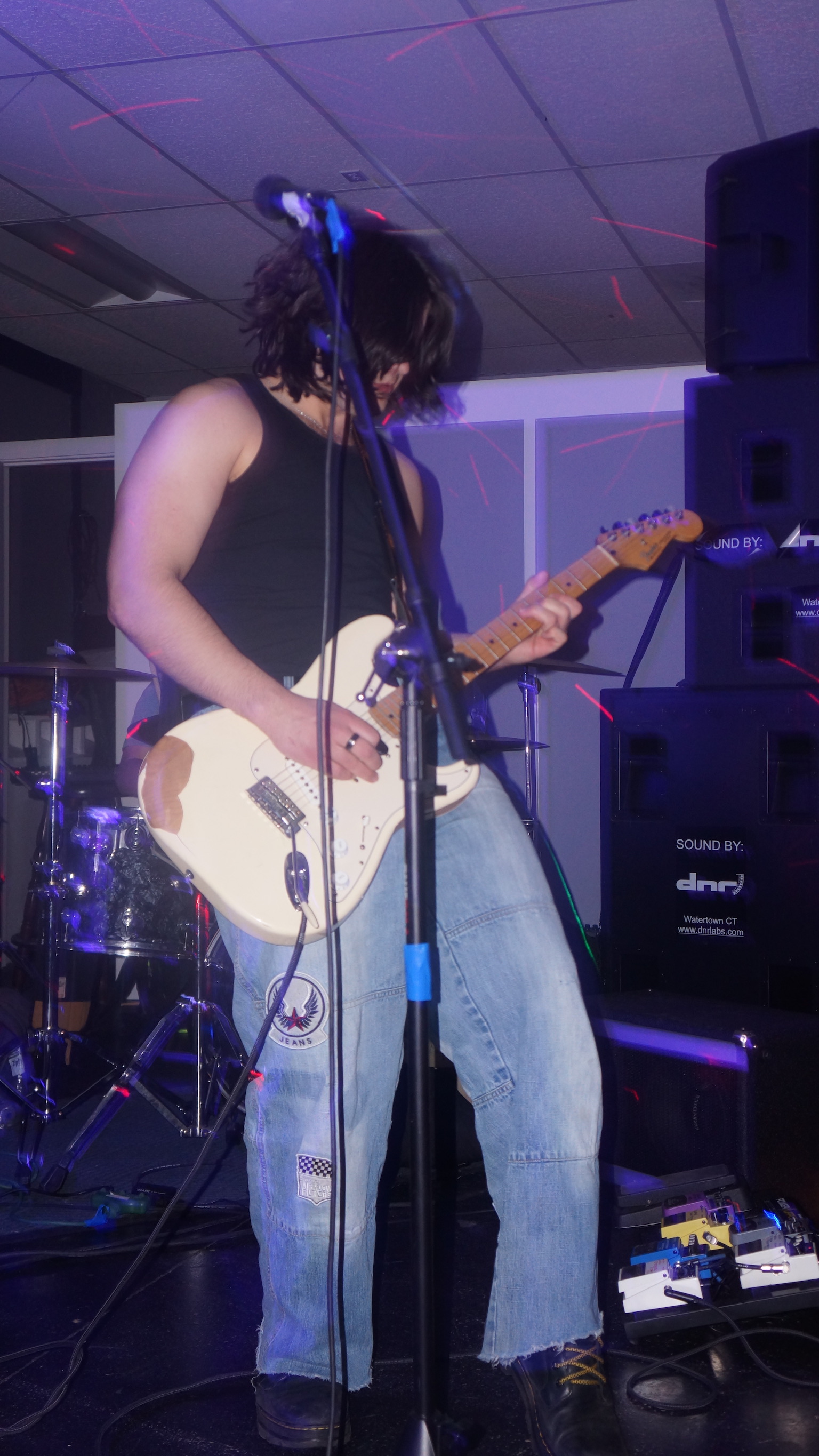 Cristiano playing guitar during performance