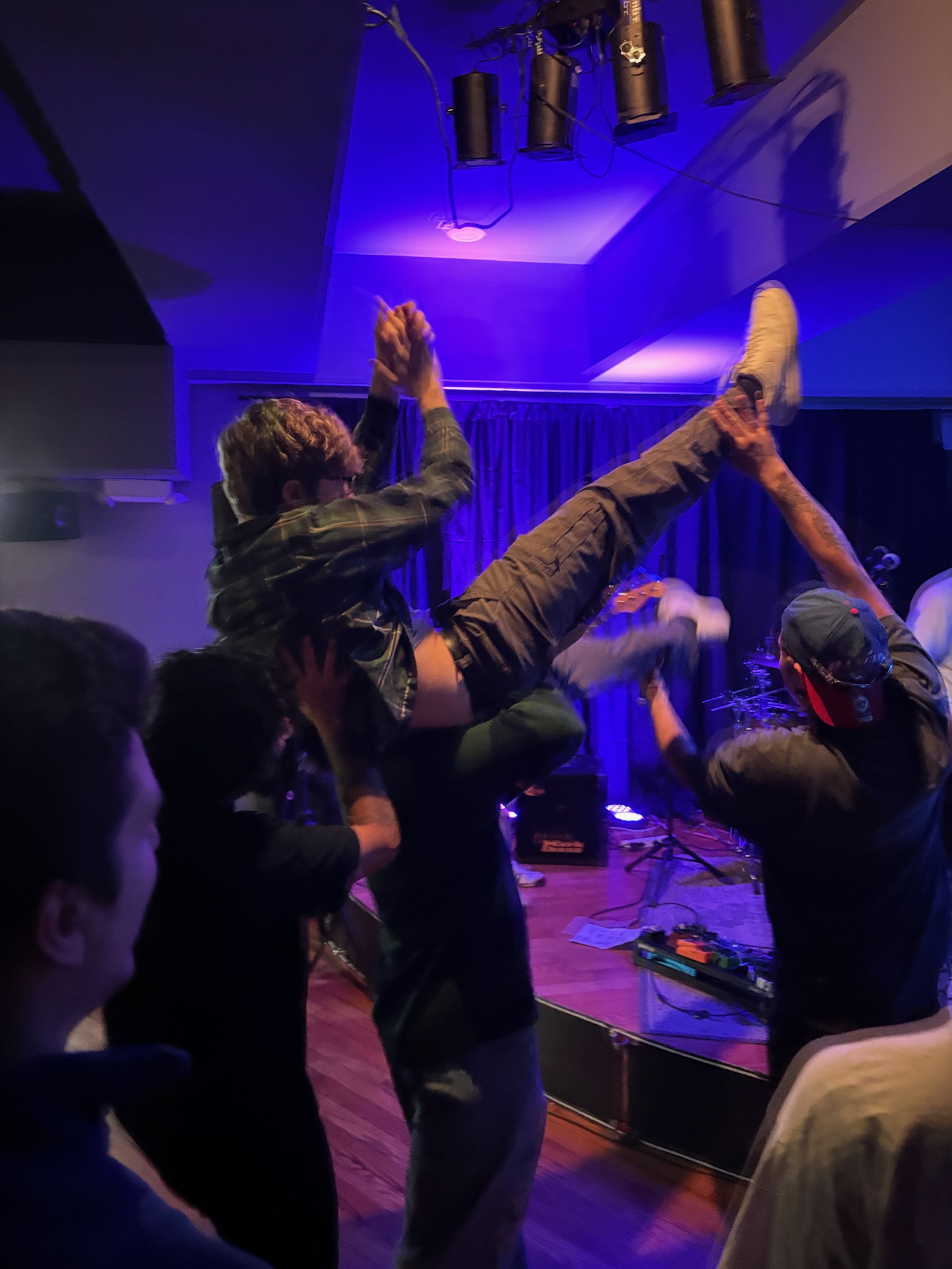 Harrison crowd surfing during live show