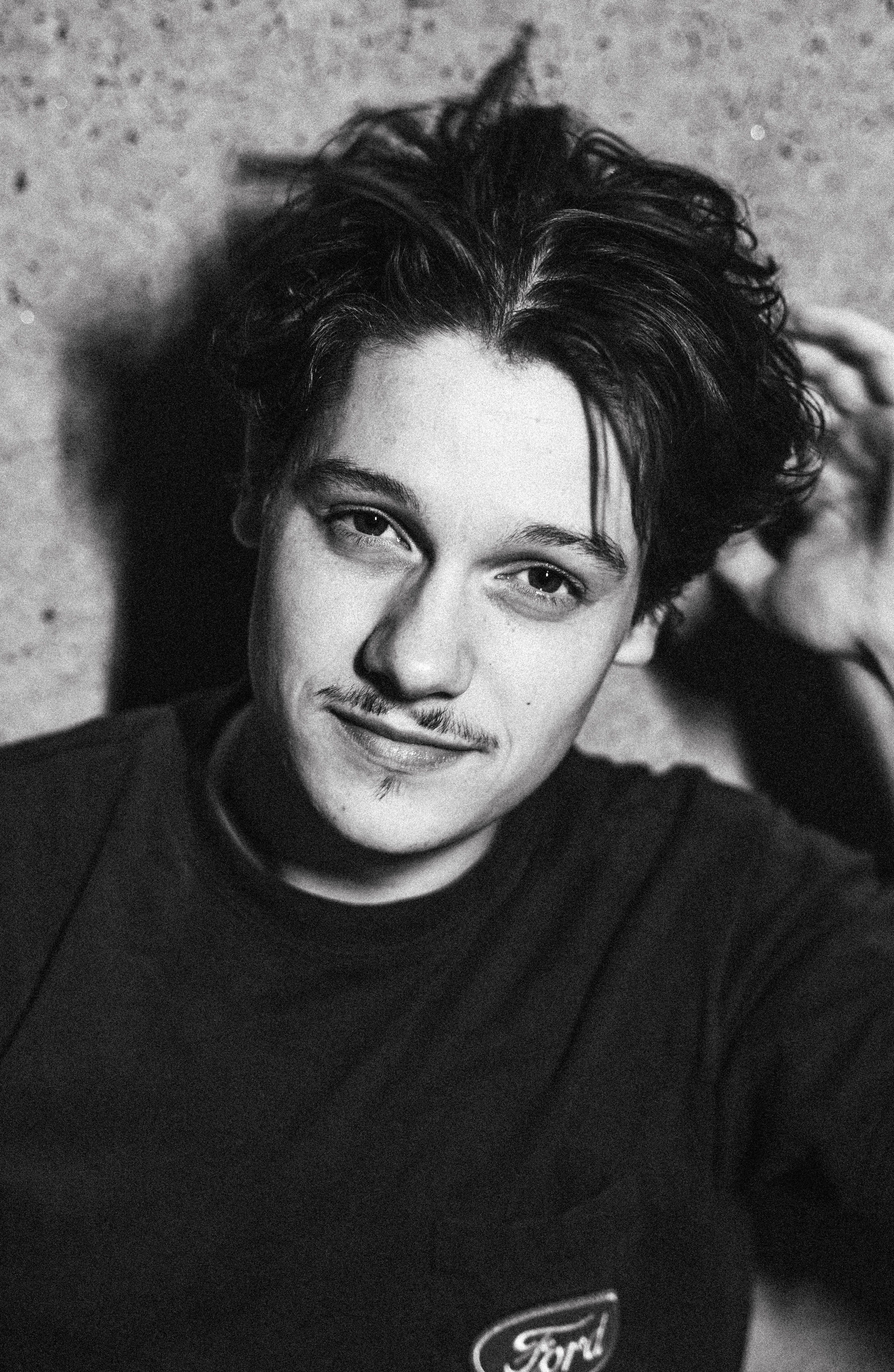 Gabe's close-up, messy hair.